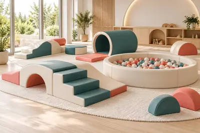 AI concept visual: a dedicated toddler play corner in a light-filled room, very low foam steps and arches, a small crawl tunnel and enclosed shallow ball pool in cream, restrained teal and muted.